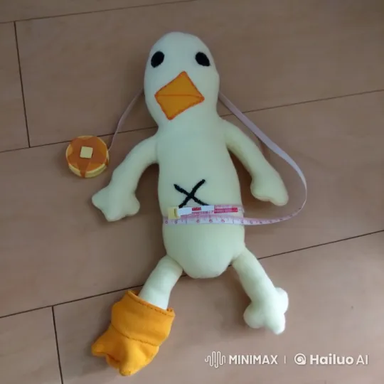 Stuffed Bird Toy Scratches Belly on Wooden Floor – AI Generated Video | Hailuo AI