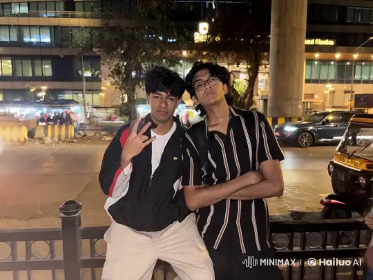 Two Friends Embrace and Kiss in Bustling Nighttime Cityscape – AI Generated Video | Hailuo AI