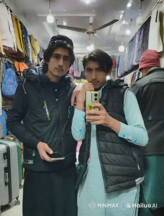 Young Men Embrace in Cozy Store Setting – AI Generated Video | Hailuo AI