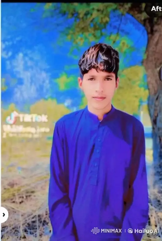 Serene Young Man in Blue Outfit Amidst Nature – AI Generated Video | Hailuo AI