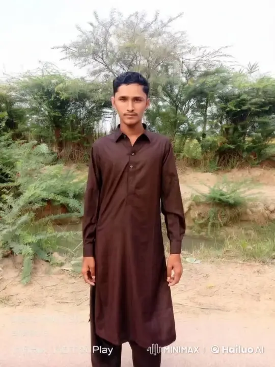 Young Man in Traditional Attire Amidst Serene Nature – AI Generated Video | Hailuo AI