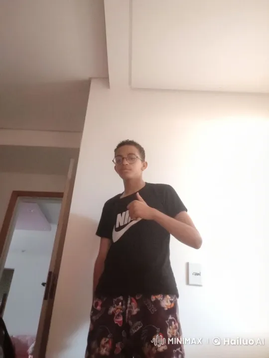 Young Man Secures Golden Ball in Dimly Lit Room – AI Generated Video | Hailuo AI