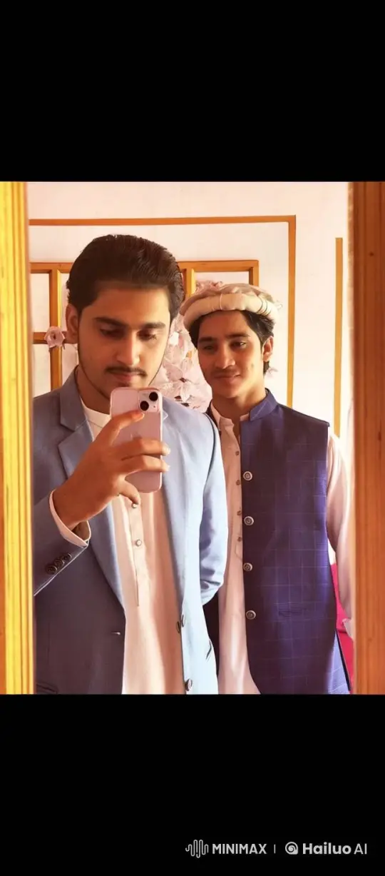 Young Men Share Moment of Affection in Mirror – AI Generated Video | Hailuo AI