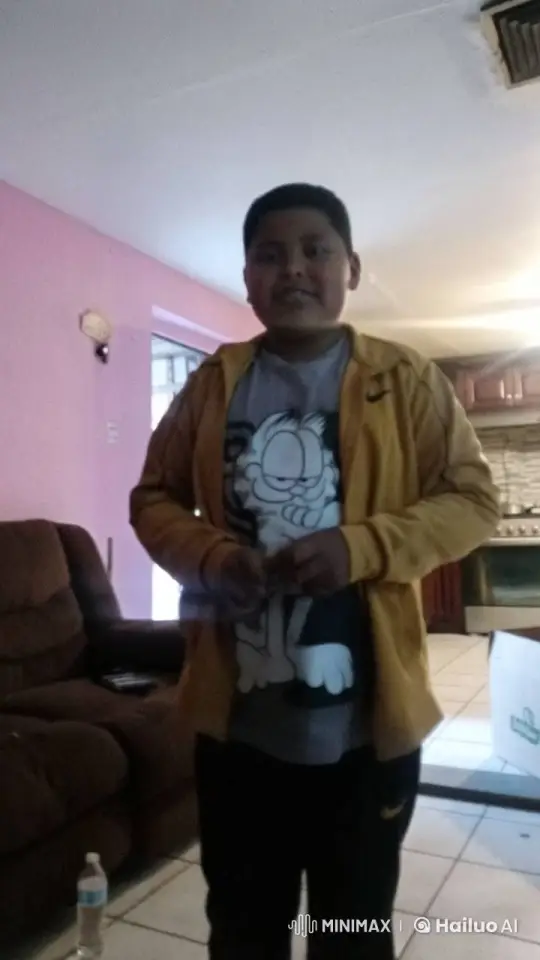 Young Boy in Cozy Room with Changing Light – AI Generated Video | Hailuo AI