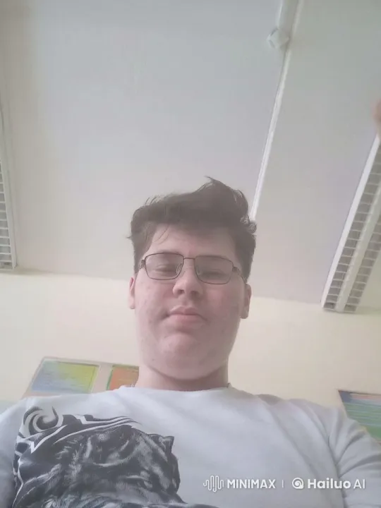 Young Man Enjoying Coffee in a Poster-Lined Room – AI Generated Video | Hailuo AI