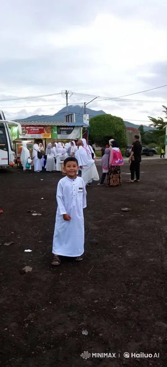 Joyful Boy in Traditional Attire at Festive Outdoor Event – AI Generated Video | Hailuo AI