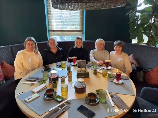 Snake Delivers Gifts to Smiling Women at Cozy Restaurant – AI Generated Video | Hailuo AI