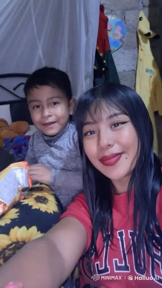 Young Woman and Child Enjoying a Cozy Selfie Moment – AI Generated Video | Hailuo AI
