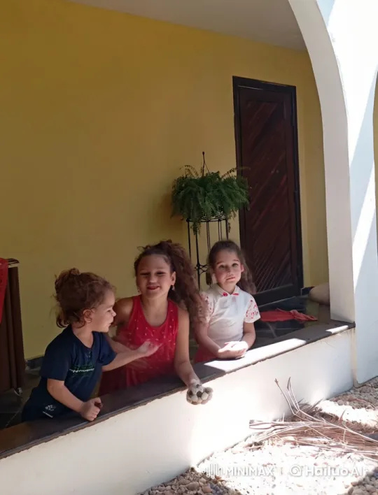 Children Embrace in Sunlit Outdoor Shelter – AI Generated Video | Hailuo AI