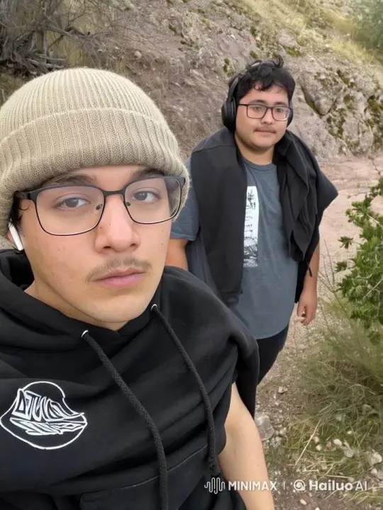 Two Friends Playfully Shoot Guns in a Rocky Landscape – AI Generated Video | Hailuo AI