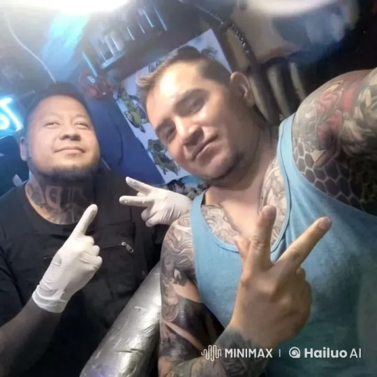 Two Men Share Affectionate Moment in Artistic Setting – AI Generated Video | Hailuo AI
