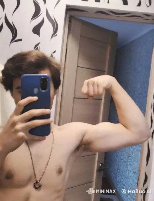 Shirtless Person Flexes Bicep in Mirror Selfie – AI Generated Video | Hailuo AI