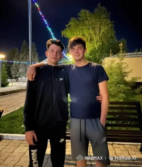 Affectionate Moment Between Two Men Under Festive Lights – AI Generated Video | Hailuo AI
