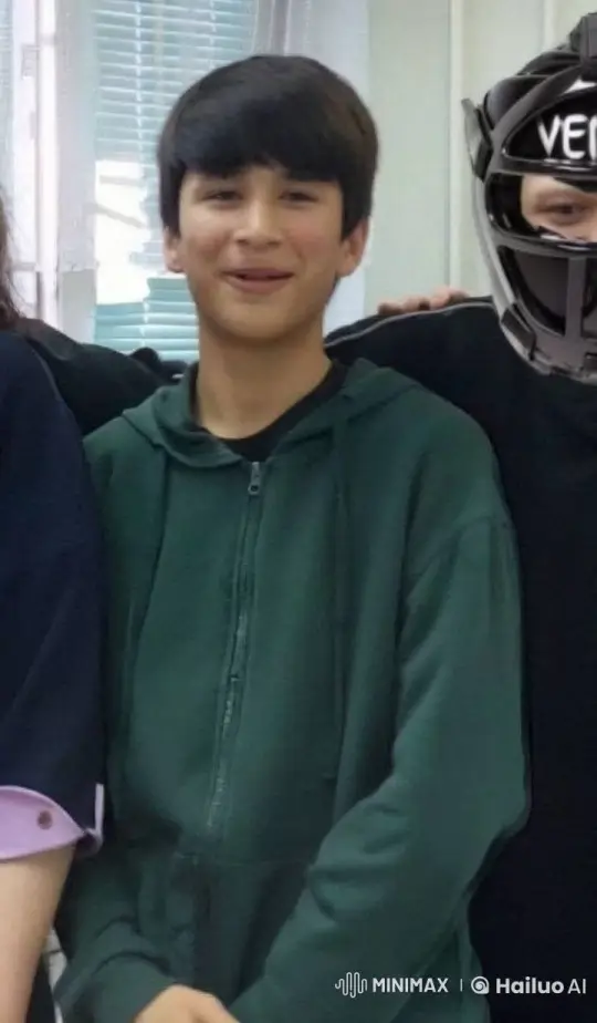 Young Man Showcases Physique in Green Sweatshirt – AI Generated Video | Hailuo AI