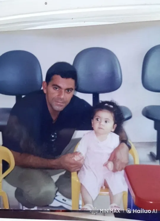 Man Supports Child in Yellow Chair, Bonding Moment – AI Generated Video | Hailuo AI