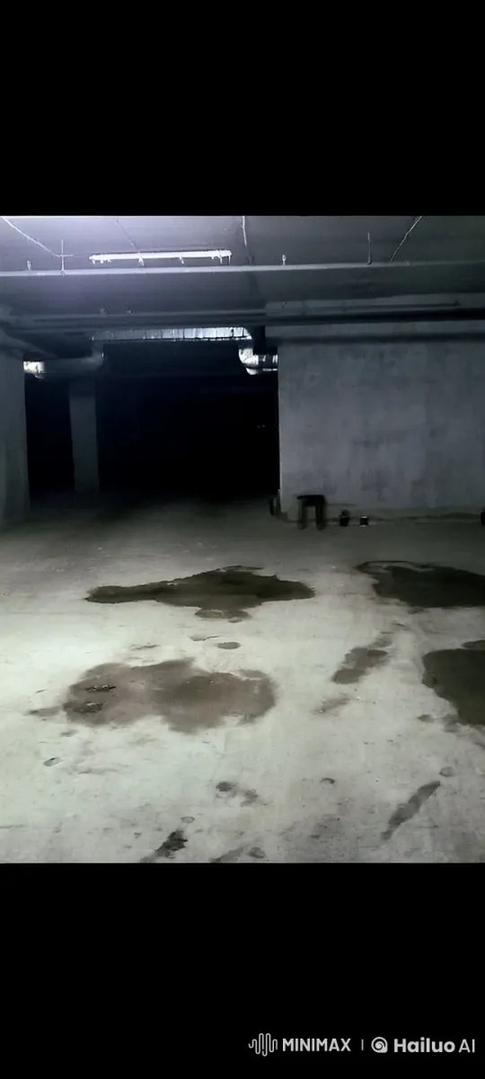 Intoxicated Man Stumbles in Eerie Parking Garage – AI Generated Video | Hailuo AI