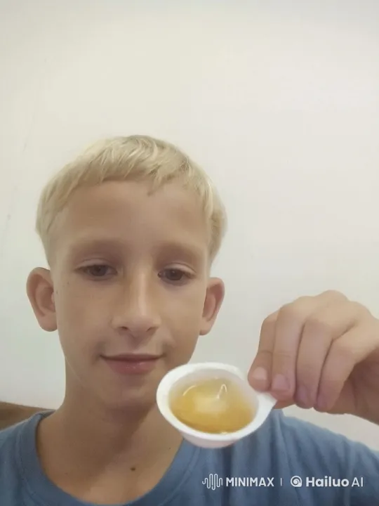 Boy Savoring Honey with Calm Delight – AI Generated Video | Hailuo AI