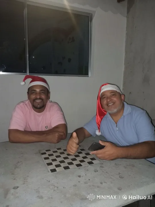 Santa Hat Video: Festive Chat at Stone Table – AI Generated Video | Hailuo AI