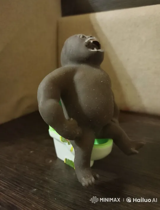 Animated Ape Figure on Mini Toilet – AI Generated Video | Hailuo AI