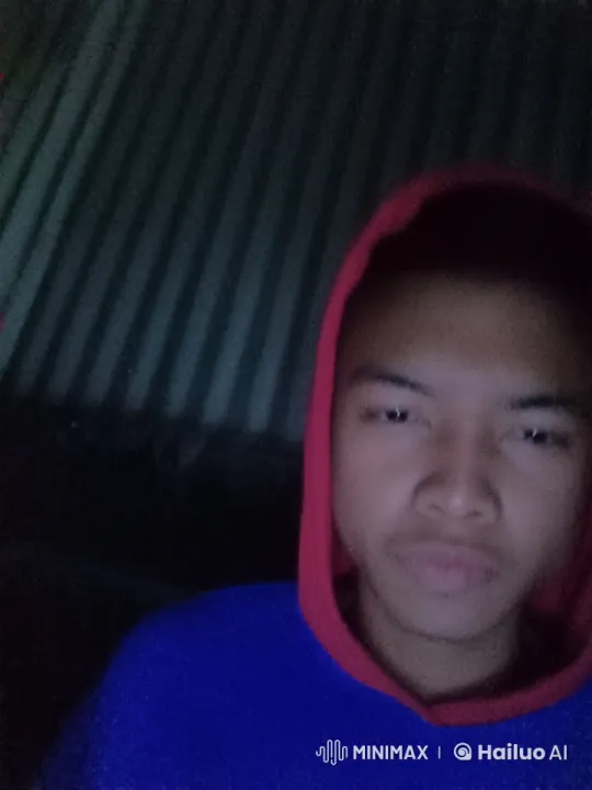 Angry Young Man in Blue Hoodie Watching Video – AI Generated Video | Hailuo AI