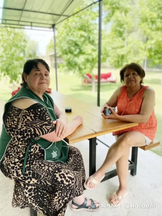 Affectionate Moment Between Two Women in a Picnic Setting – AI Generated Video | Hailuo AI