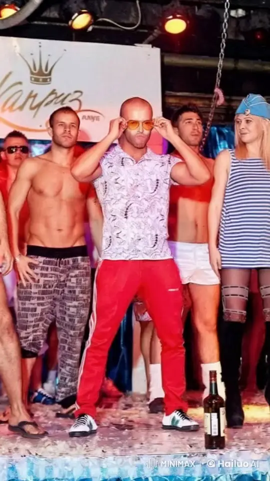 Confident Bald Man Poses with Group on Festive Stage – AI Generated Video | Hailuo AI