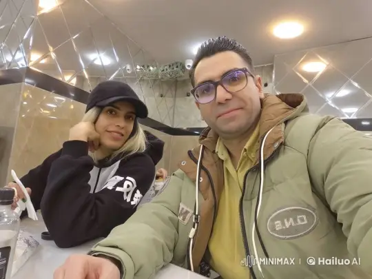 Animated Cafe Scene with Two Smiling Individuals – AI Generated Video | Hailuo AI