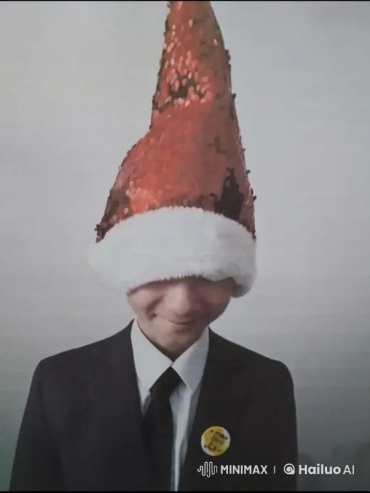 Person in Formal Suit with Festive Hat Smiles – AI Generated Video | Hailuo AI