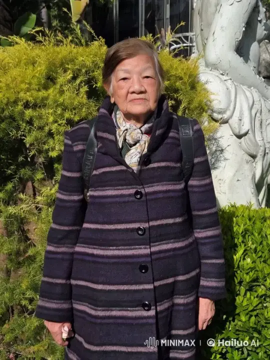 Elderly Woman Speaks Confidently in Front of Greenery – AI Generated Video | Hailuo AI