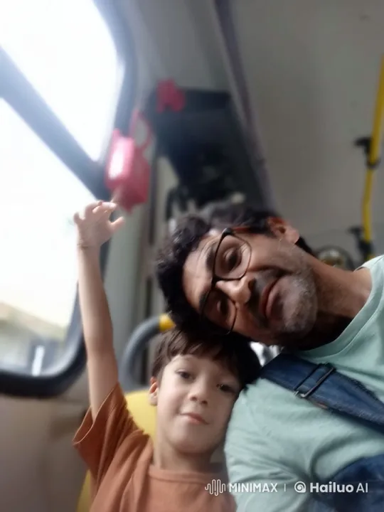 Man and Child on Bus, Pointing Out Window – AI Generated Video | Hailuo AI