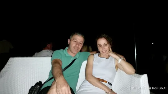 Casual Evening Out: Two Friends Relaxing on a Sofa – AI Generated Video | Hailuo AI