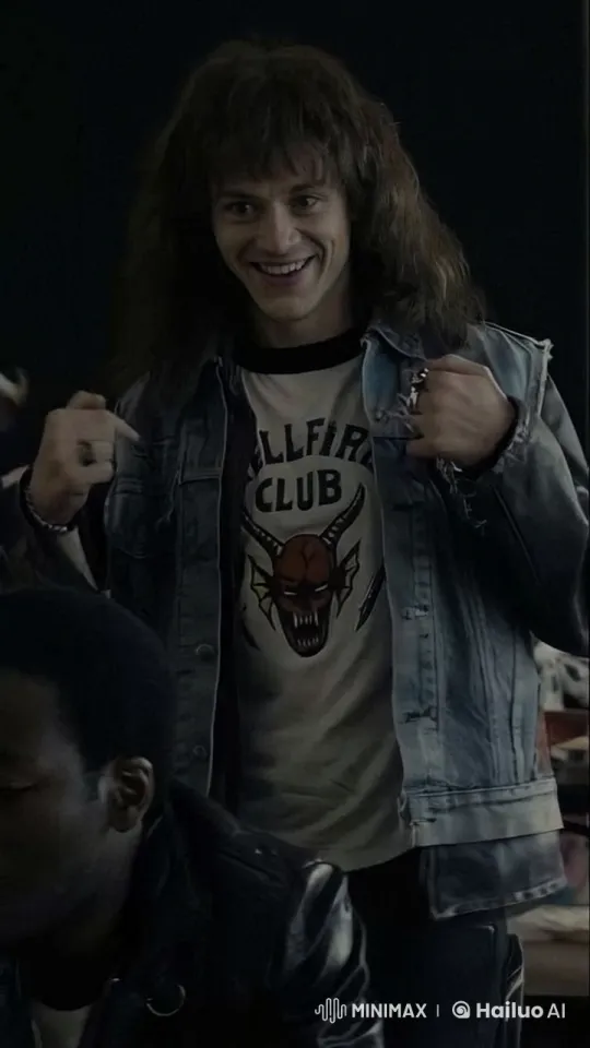 Young Man Enthusiastically Plays Guitar in "Hellfire Club" Shirt – AI Generated Video | Hailuo AI