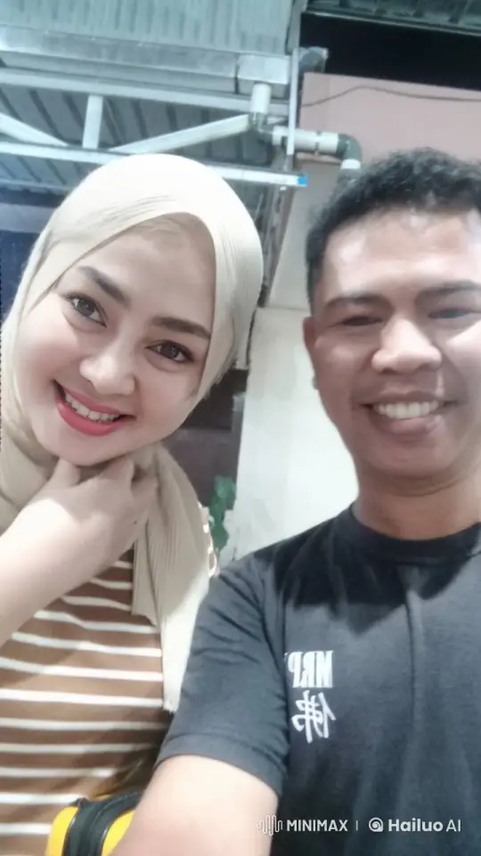 Couple's Tender Moment with Hijab Adjustment – AI Generated Video | Hailuo AI