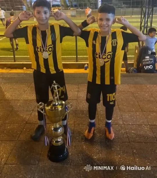 Soccer Boys Celebrate Victory with Cheek Kiss – AI Generated Video | Hailuo AI