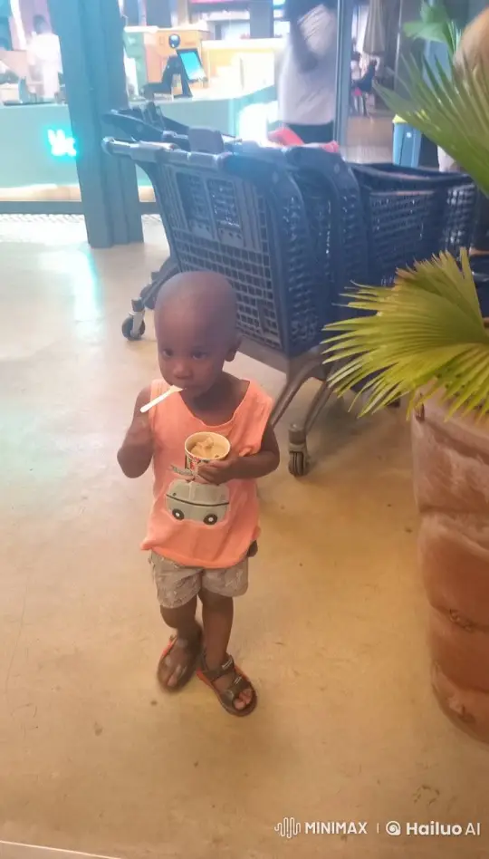 Child Enjoying Ice Cream in Festive Store Scene – AI Generated Video | Hailuo AI