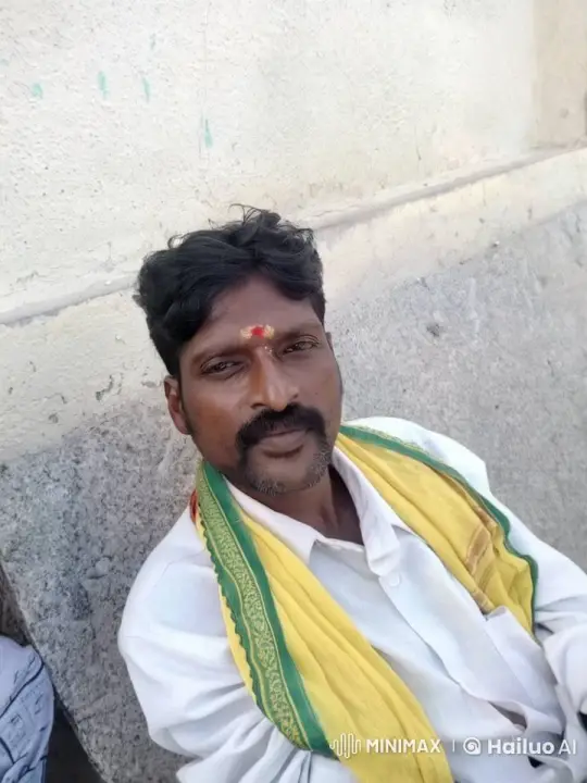 Man Smiles with Warmth Against Granite Wall – AI Generated Video | Hailuo AI