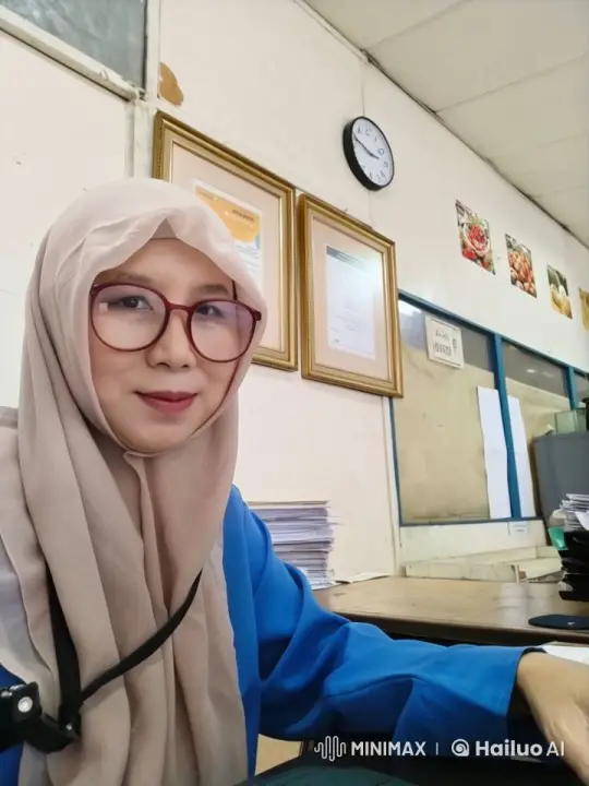 Woman in Hijab Works on Laptop in Office Setting – AI Generated Video | Hailuo AI