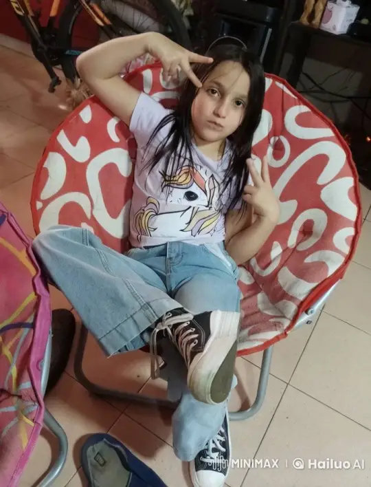 Girl in Chair Makes Peace Signs, Imaginary Fight – AI Generated Video | Hailuo AI