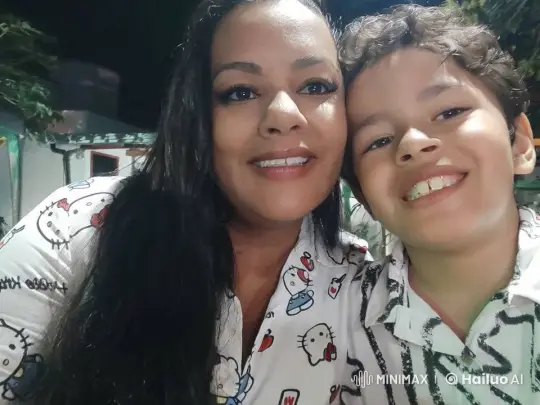 Woman and Boy Smiling in Nighttime Outdoor Scene – AI Generated Video | Hailuo AI