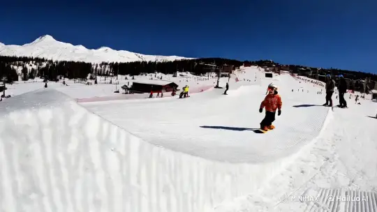Boy Snowboarder Soars with Joy in Ski Resort Landscape – AI Generated Video | Hailuo AI