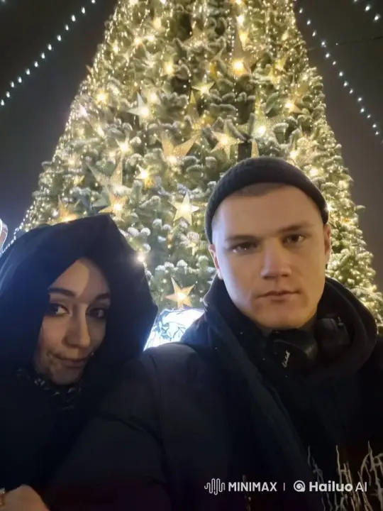 Holiday Kiss in Front of Festive Christmas Tree – AI Generated Video | Hailuo AI