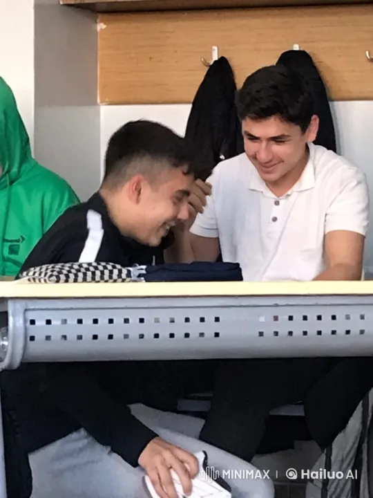 Affectionate Moment Between Two Young Males in Classroom – AI Generated Video | Hailuo AI