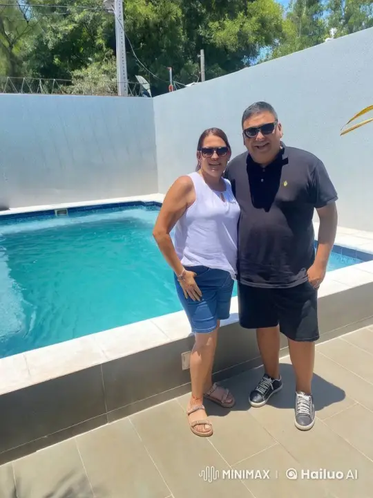 Couple Embraces by Sparkling Pool in Sunlight – AI Generated Video | Hailuo AI