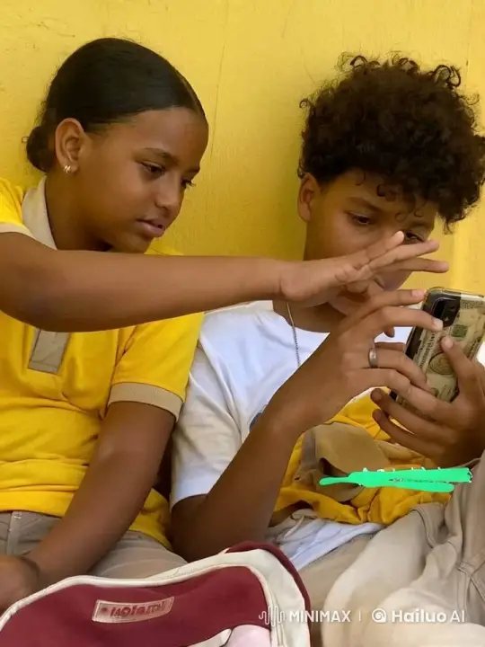 Children Share Intimate Moment Against Yellow Wall – AI Generated Video | Hailuo AI