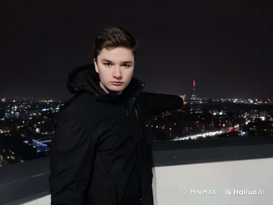 Young Man Appreciates Nighttime Cityscape – AI Generated Video | Hailuo AI