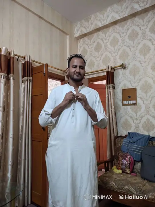 Man in White Outfit Dancing Casually in Traditional Setting – AI Generated Video | Hailuo AI