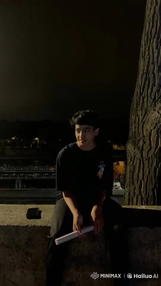 Young Man Rolls and Smokes Cigarette Under Night Sky – AI Generated Video | Hailuo AI