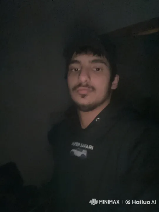 Young Man in Dim Room Smokes Calmly – AI Generated Video | Hailuo AI