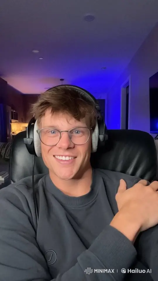 Animated Person Smiling in Blue-Lit Room with Live2D Effects – AI Generated Video | Hailuo AI