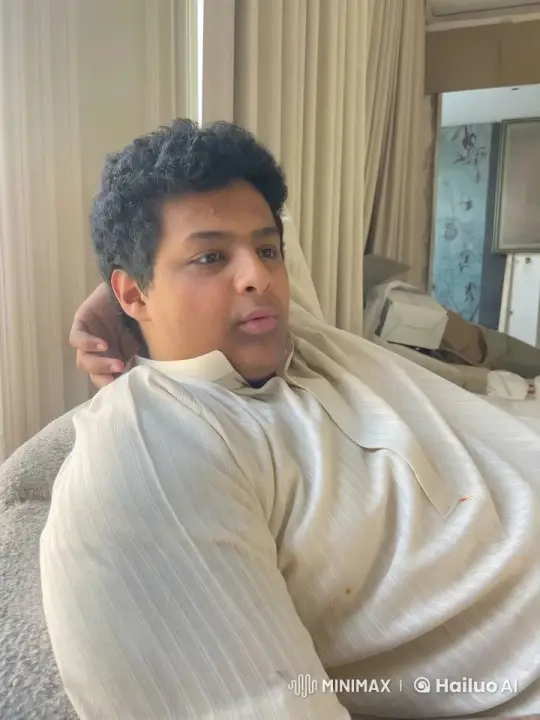 Young Man Relaxing with Cigarette in Couch Scene – AI Generated Video | Hailuo AI